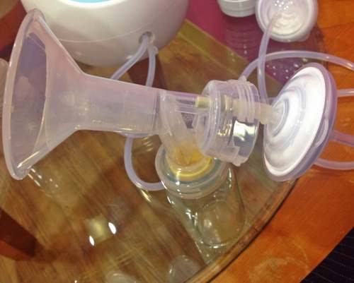 Maymom connected to Spectra breast pump